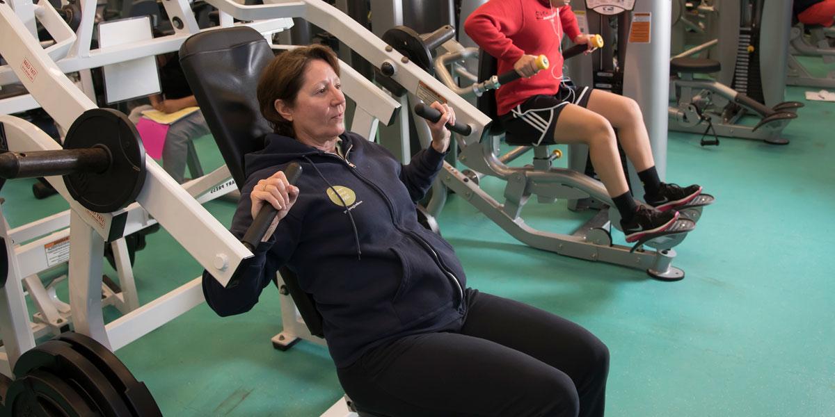 AACC student in weight lifting class.